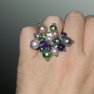Multicolored pearls on a silver wide metal ring